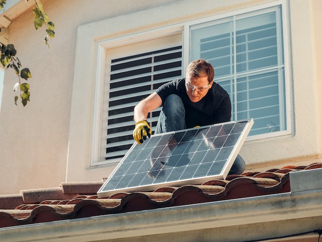 A-European-is-installing-photovoltaic-panels